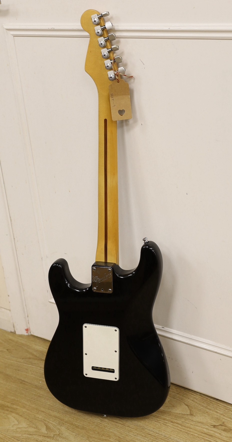 A 1980’s Fender Stratocaster, U.S.A. Serial No. E451951, lace sensor pickups with hard flight case, 98cms high.